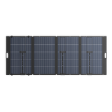 Foldable 400W portable solar panel with four segments and carrying handles, black frame.