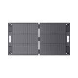BLUETTI PV100 100W portable solar panel unfolded flat, showing the two monocrystalline panel sections and both carry handles