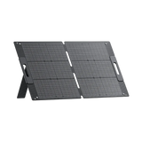 BLUETTI PV100 100W portable solar panel standing at an angle on its rear kickstand, ready to face the sun