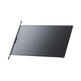 BLUETTI PV100 FX flexible solar panel lying flat, angled view from the right, with the junction box and MC4 leads along the left edge